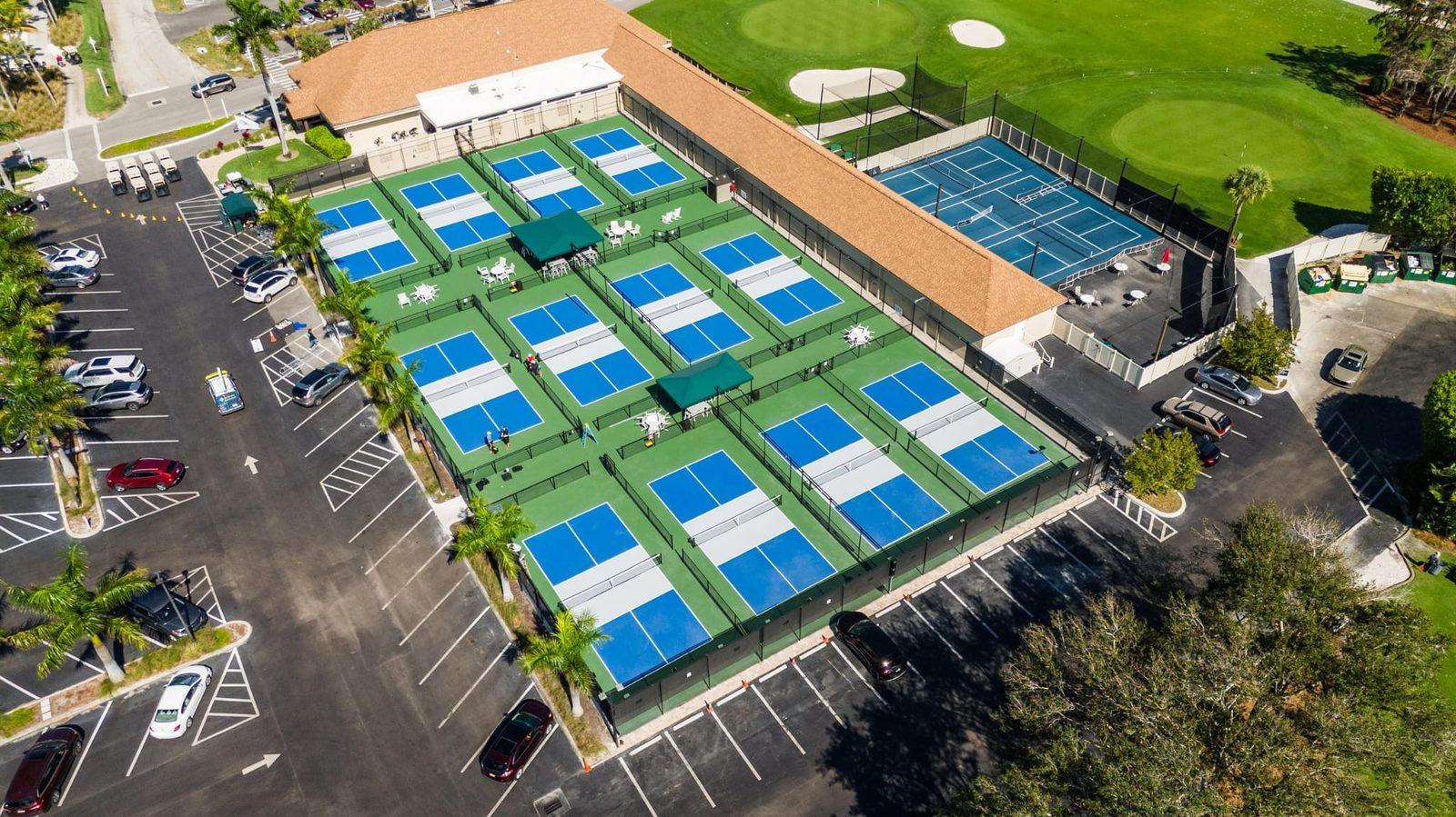 Aerial view of the pickleball courts and clubhouse at Glades Golf & Country Club, Naples