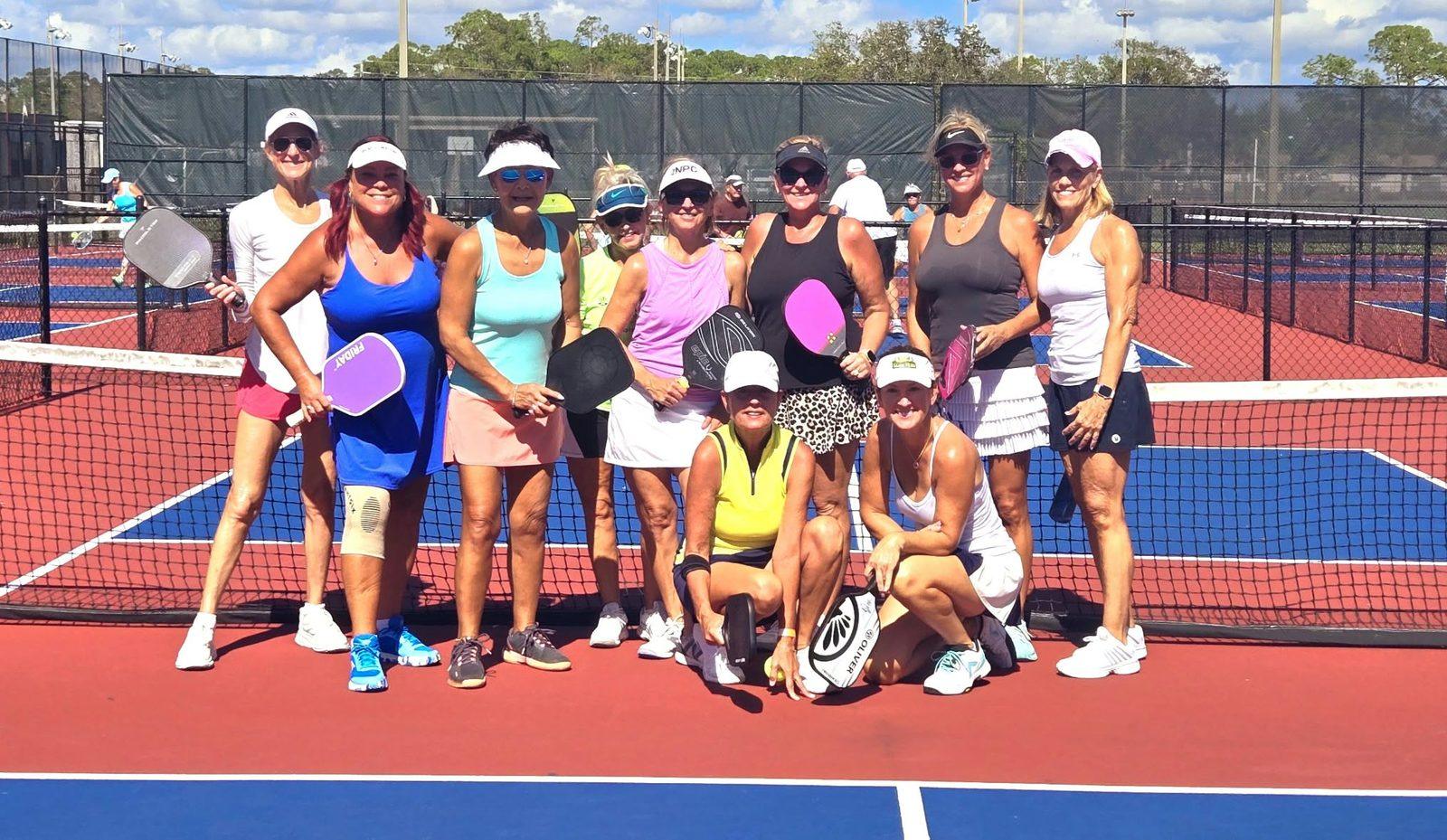 Jill Jacobs with her ladies' pickleball group at the net